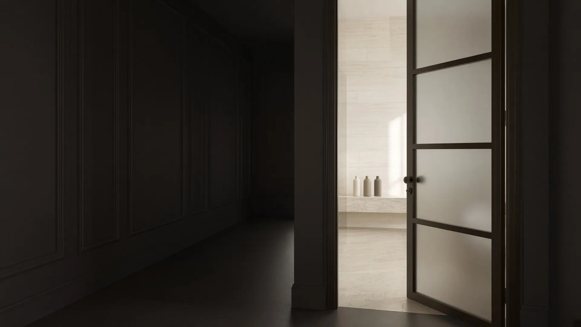 A frosted glass door slightly open onto a softly lit bathroom with plain bottles